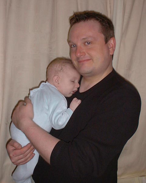 [Clive puts a sleeping son to bed]